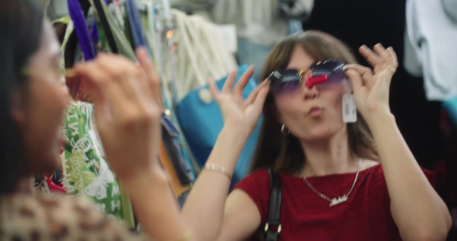 Woman trying on sunglasses in a store