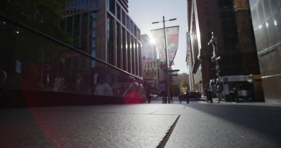 Pedestrians walking along urban streets in a metropolis