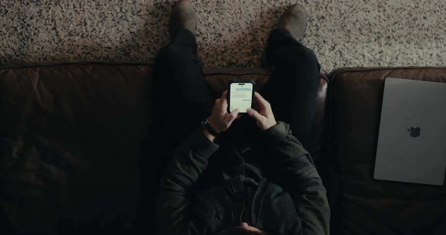 A footage of a person texting on a smartphone
