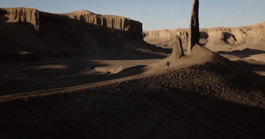 A man is running through the canyon