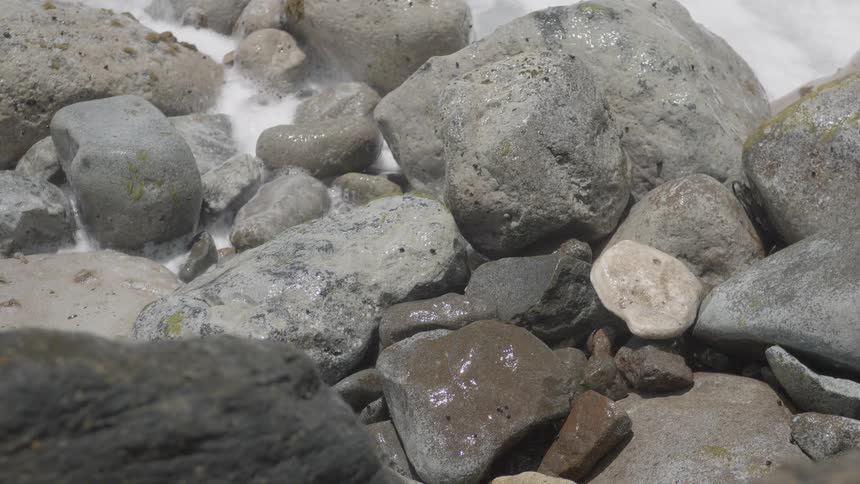 Water crashes on the rocks