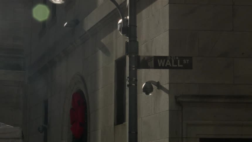 The wall street sign on a sunny day