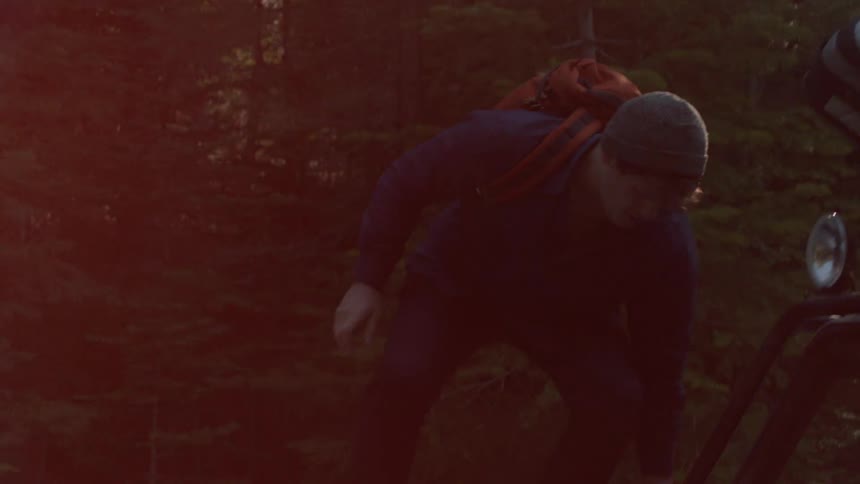 Hikers grab their backpacks and head off into the woods