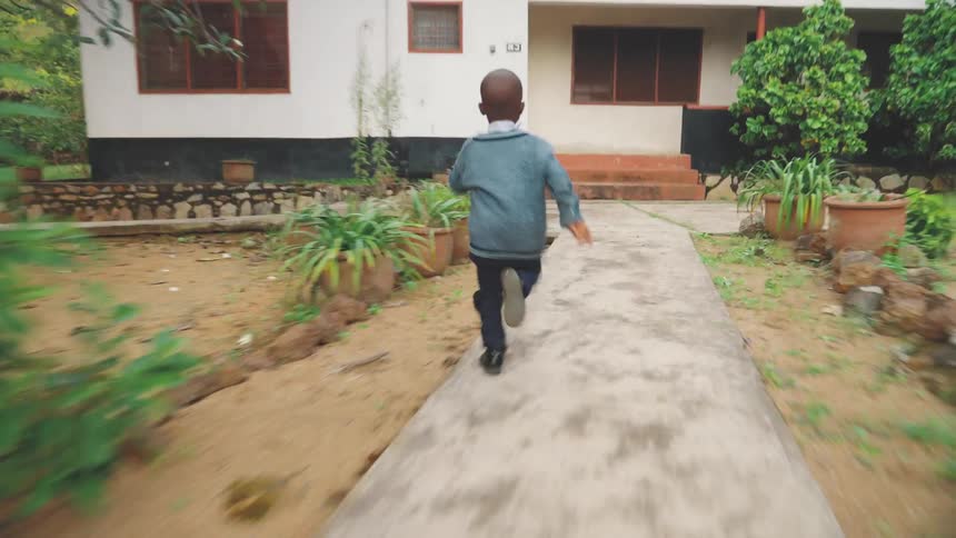 A clip of a kid running the vegetation land