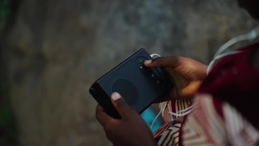Finger clicking the button on a device in your hands