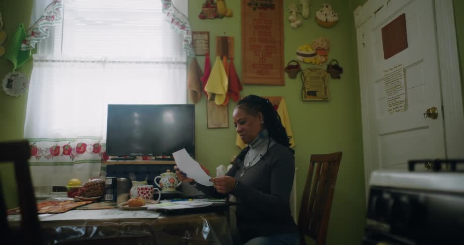 A clip of a lady reading a letter