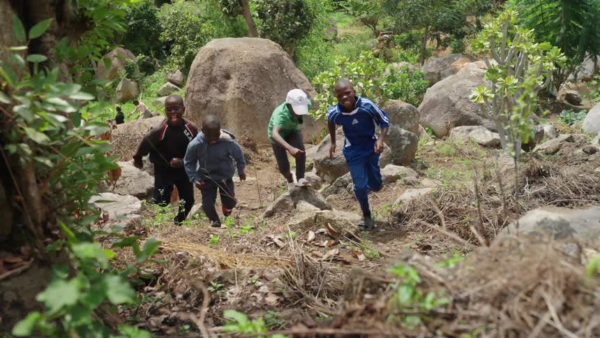 A footages of kids running in the bush