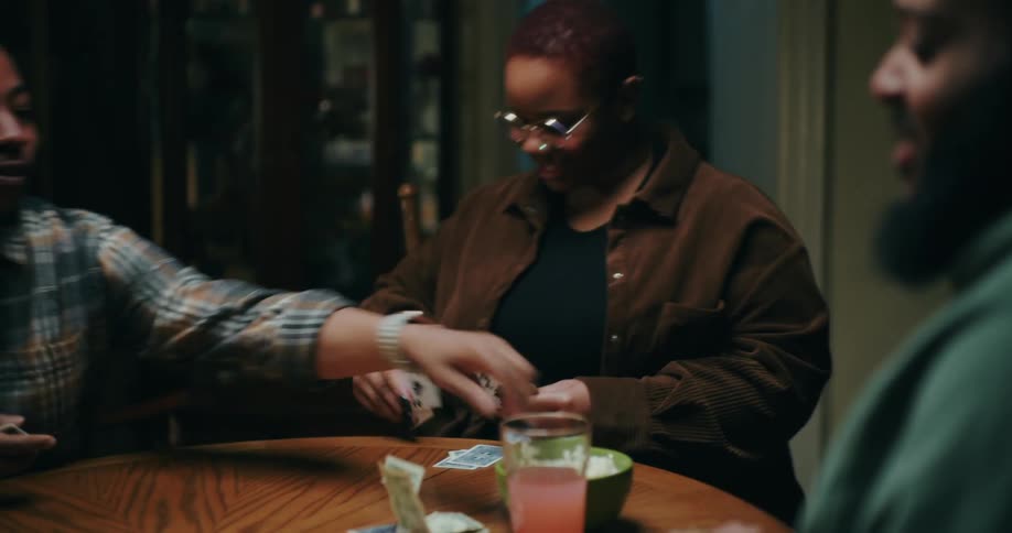 A footage of people playing a card game and having fun