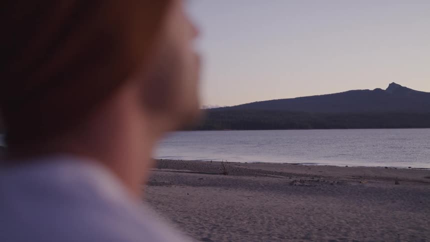 A man is looking at over the lake