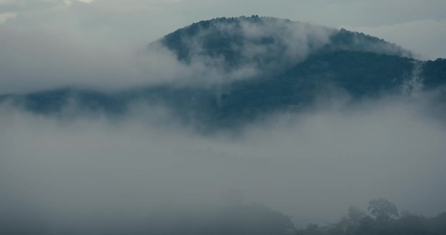 Fog rolling across the mountains in the morning