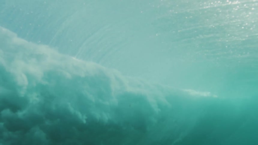 Underwater view of a wave crashing in the ocean