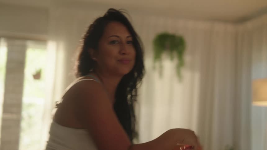 Woman dancing in the living room