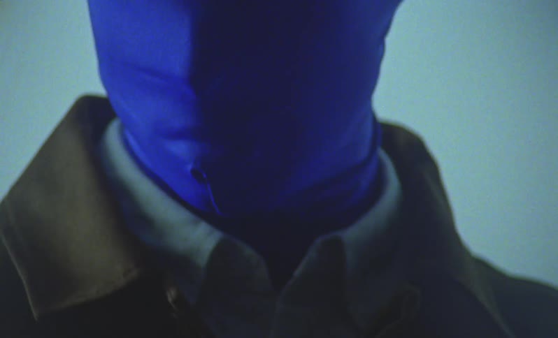 Person wearing a tightfitting blue hood covering their entire face