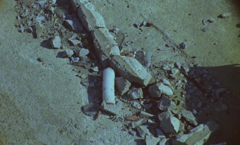 Column of broken stones on a ground