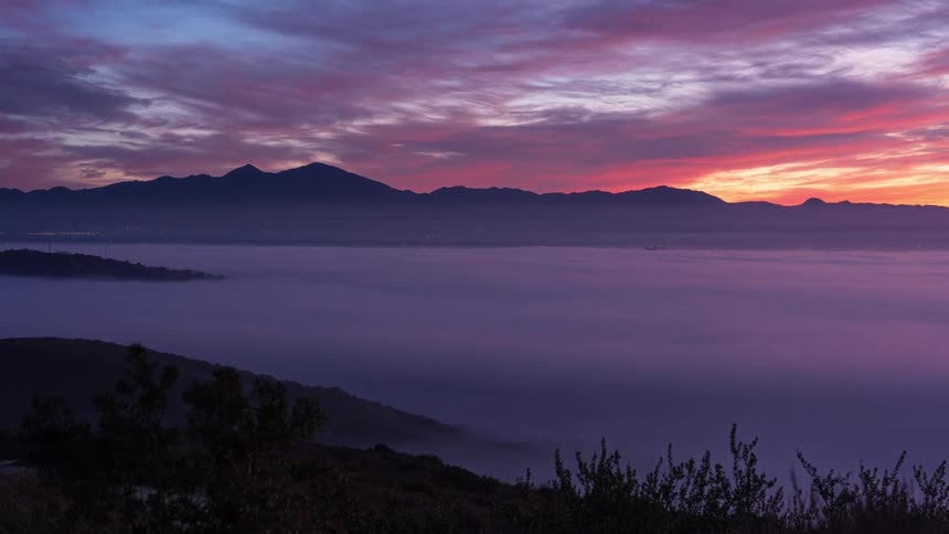 A mesmerizing timelapse reveals shifting hues as clouds drift across the sky