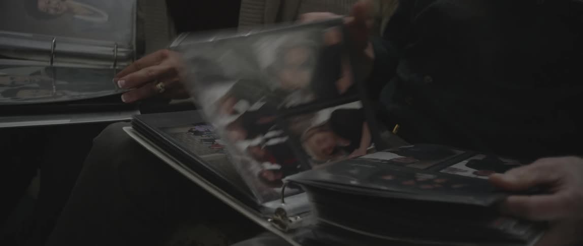 People look through photo albums
