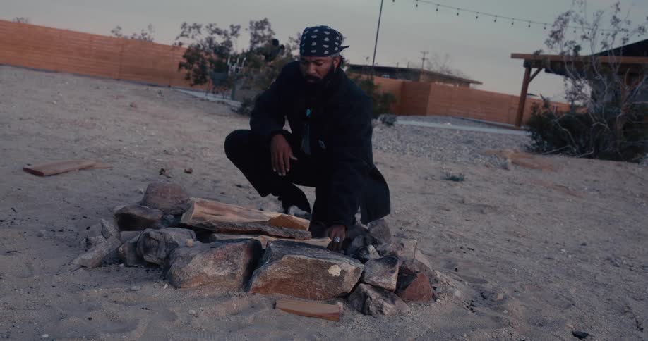 A man is building a campfire