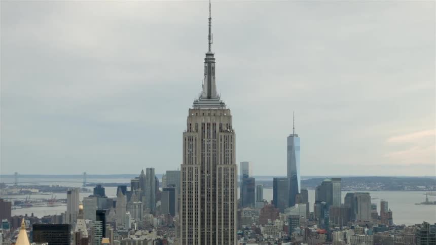 City buildings and skyscrapers stand in the distance