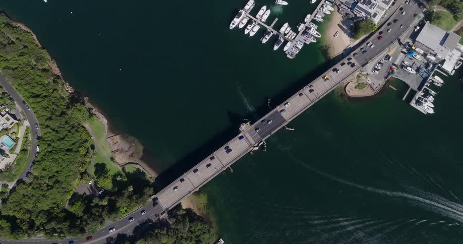 An aerial footage of a connecting bridge at the shore area