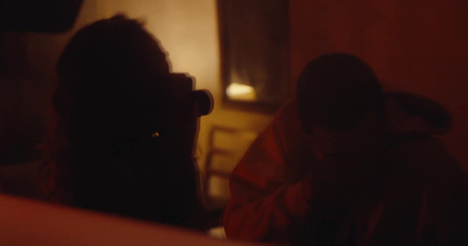 A clip of a man and a woman having fun in a room