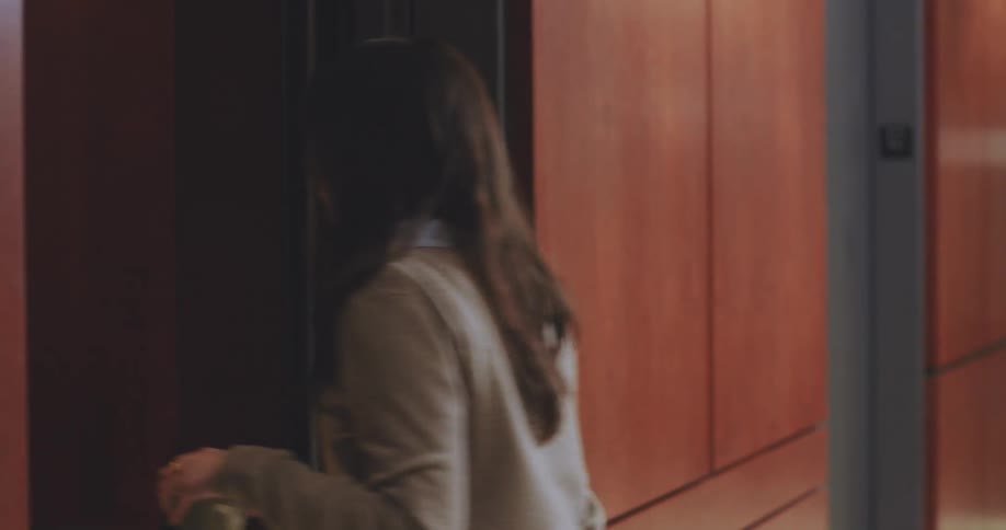 Woman entering an elevator