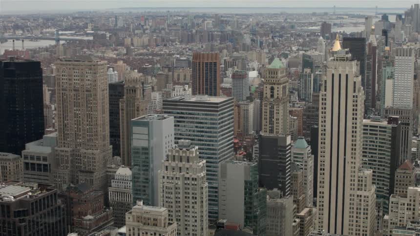 A city skyline is being filmed from the air