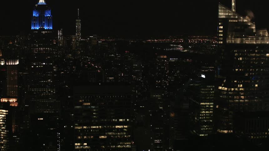 Office and city lights illuminate a large city at night