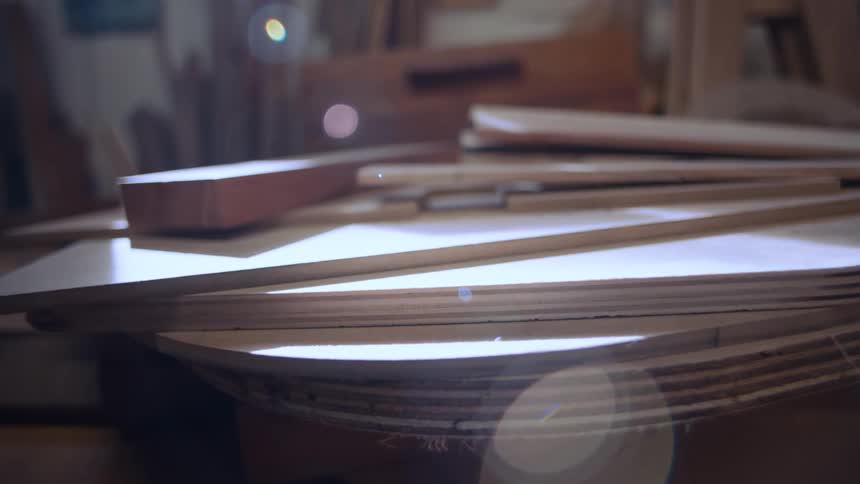 Carpenters wooden pieces with sun reflection