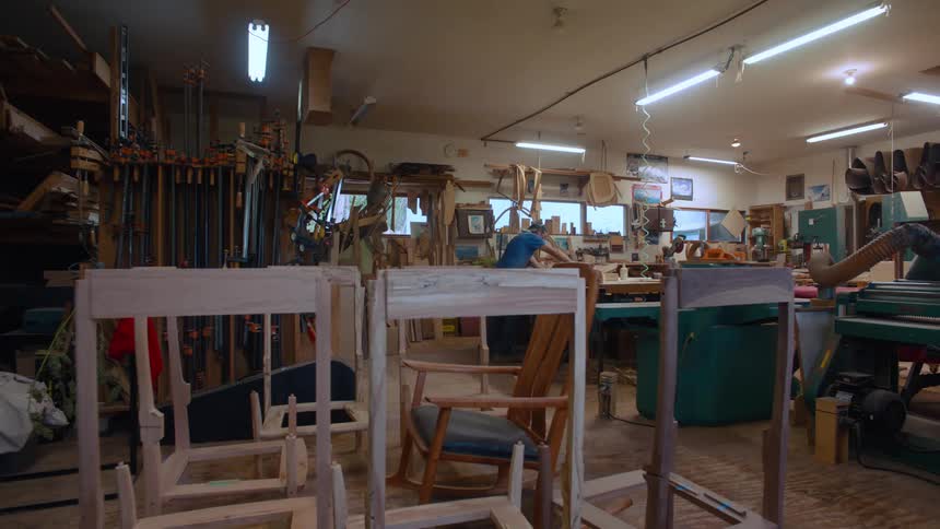 Carpenter working in a workshop during the day