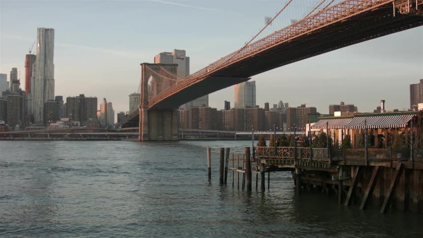 Water flows under a large city bridge