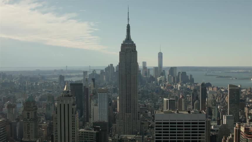 The empire state building standing amongst other large buildings