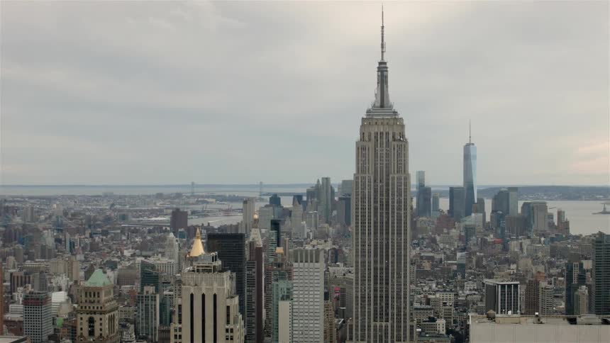 City buildings and skyscrapers stand in the distance