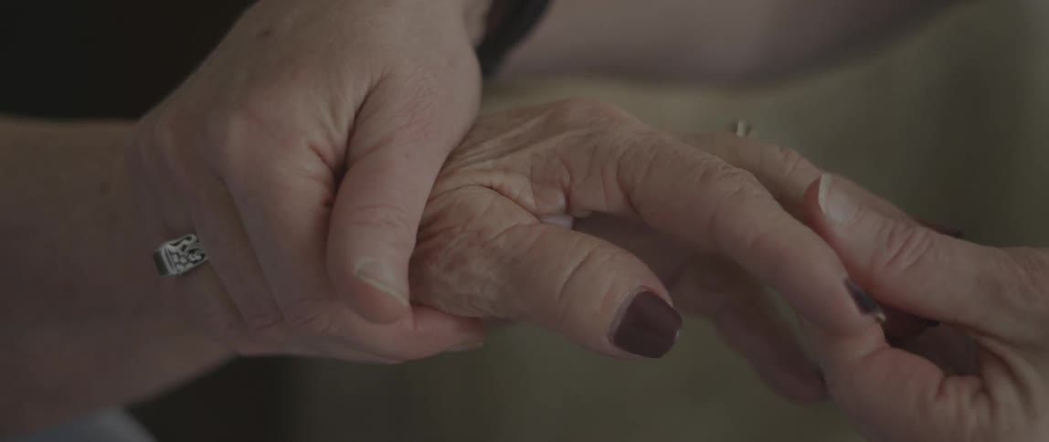 A person has their hand rubbed