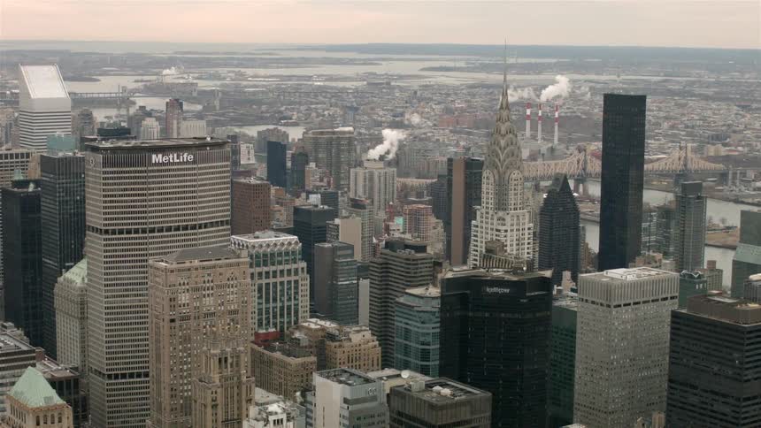 City buildings and skyscrapers stand in the distance