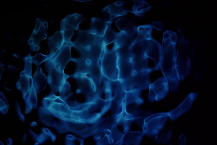 Abstract closeup on a neon blue liquid