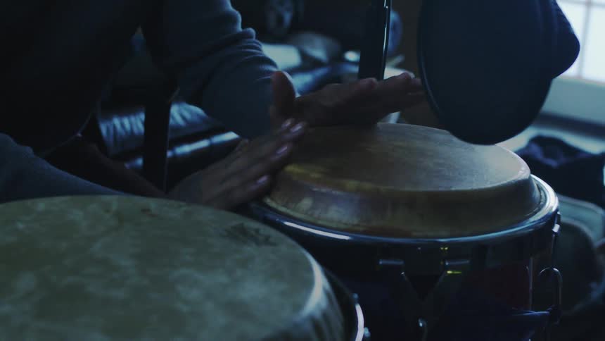 A footage of a person drumming