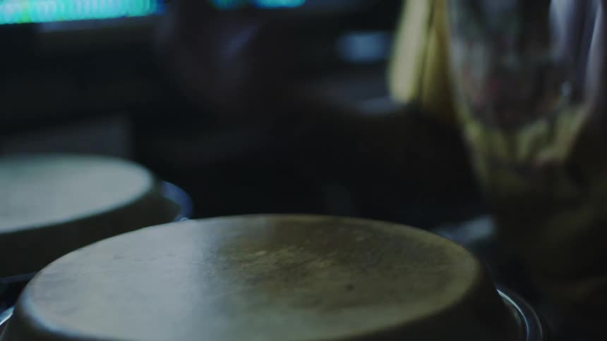 Pair of hands beating a drum
