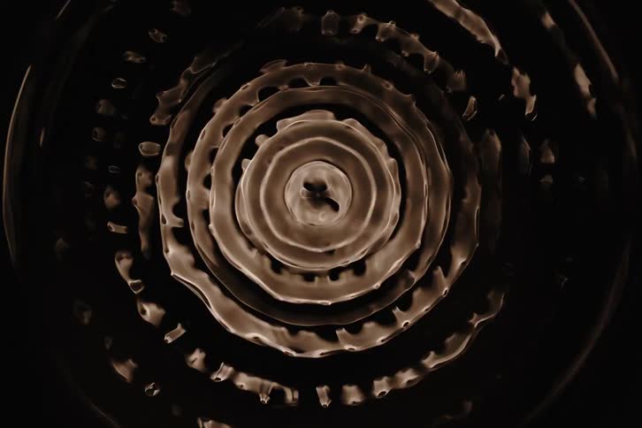 Close up of liquid inside a container shaking