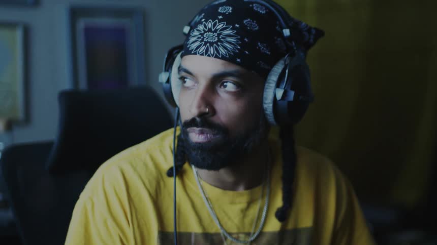 Man enjoying music while wearing a headband and headphones