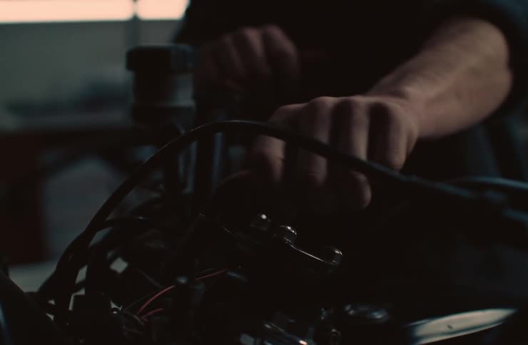 A mechanic is working on an engine