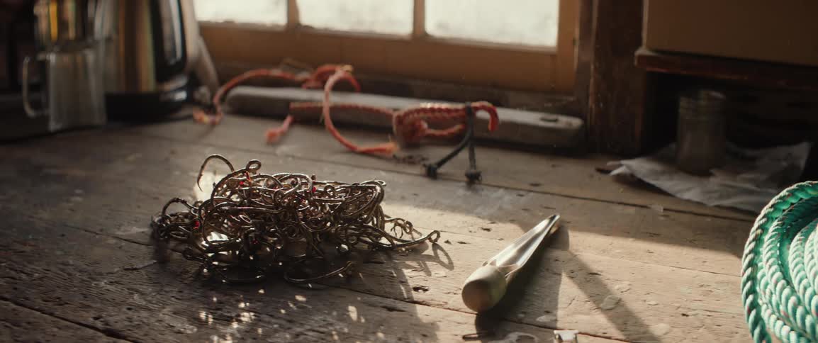A close up of fishing hooks and tools on a table