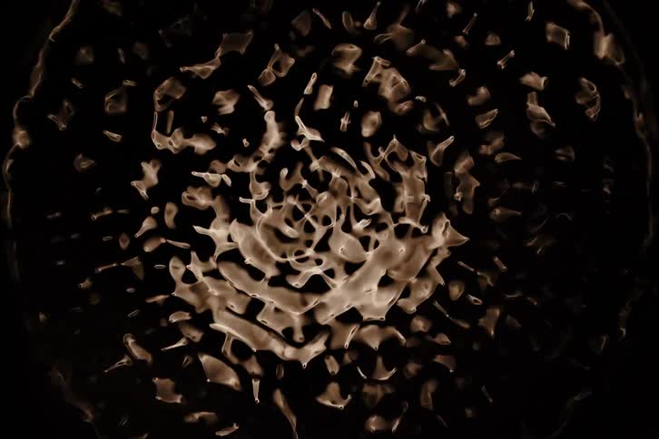 Clear liquid is spun and then vibrated in order to form various shapes