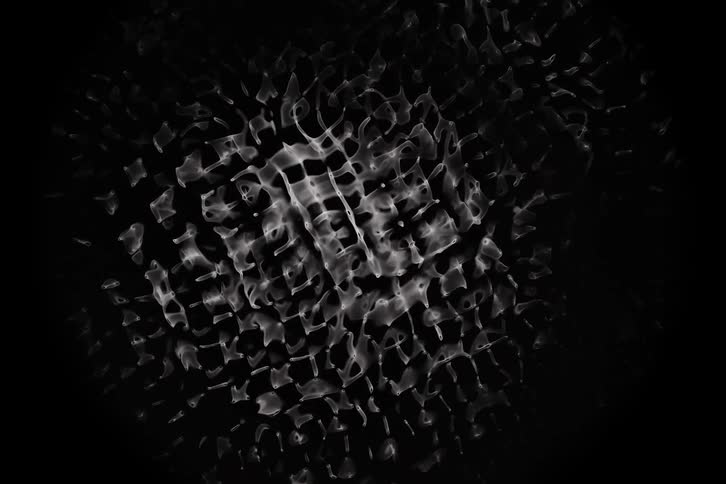 An abstract pattern of white wavy lines and shapes on a black background