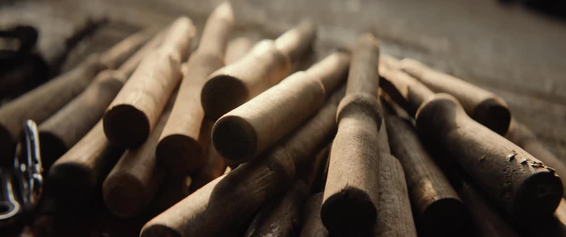 Close up of wooden dowels on the workbench