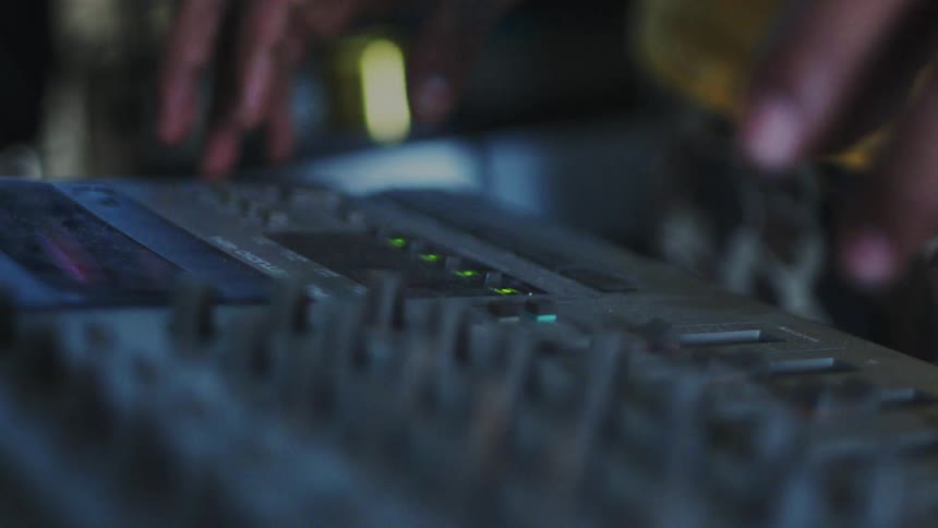 A footage of a person operating a sound engine