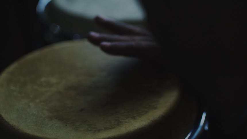 Close up of hands playing a set of drum