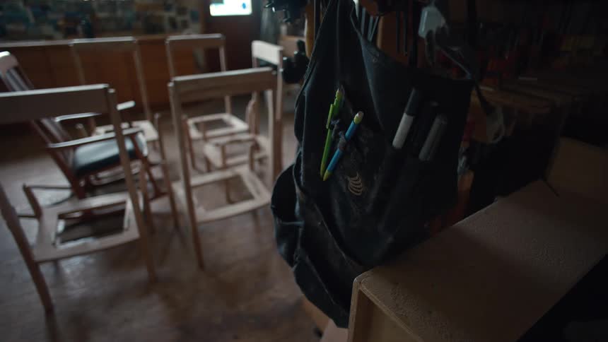 Tools hang from a bag in the shop