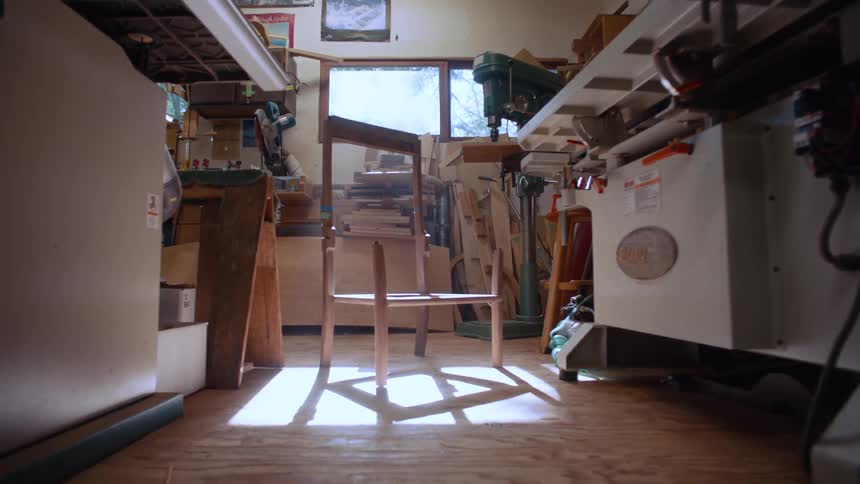 Wooden chair in production in the hallway of a carpenters workshop
