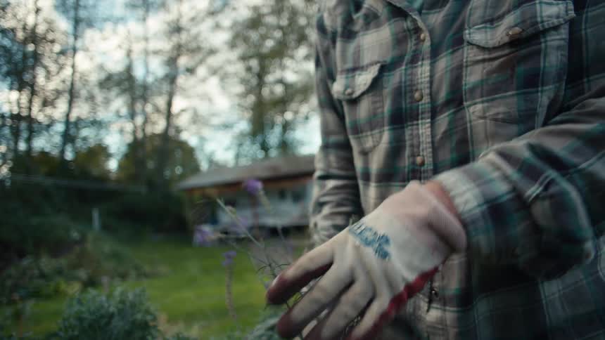 Hands with gloves and pliers doing gardening