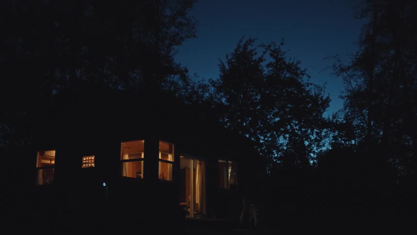 A night clip of a house with electricity turned on